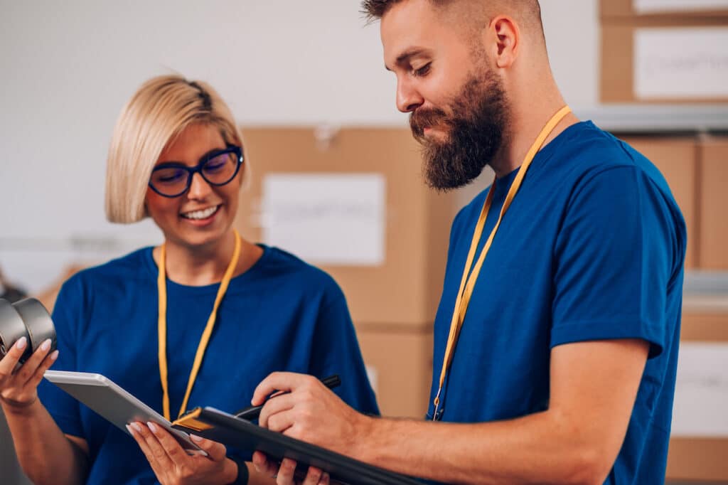 volunteers working at a donation center and discussing nonprofit cybersecurity