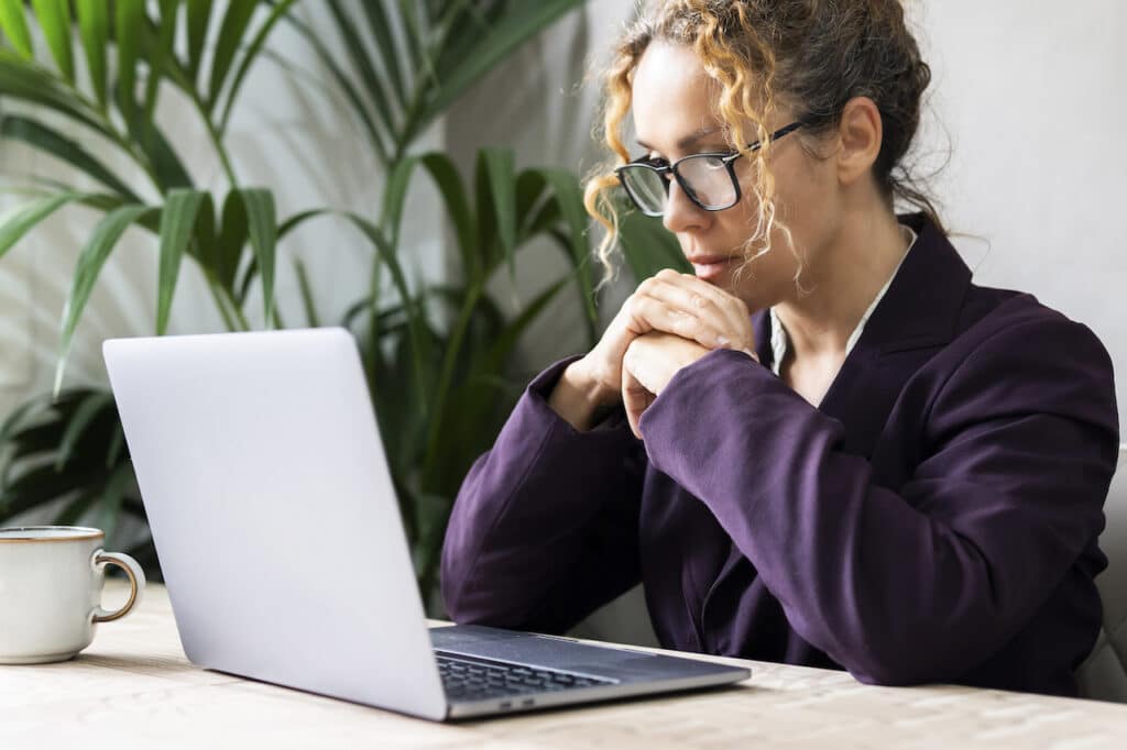 employee learning about cybersecurity best practices on laptop