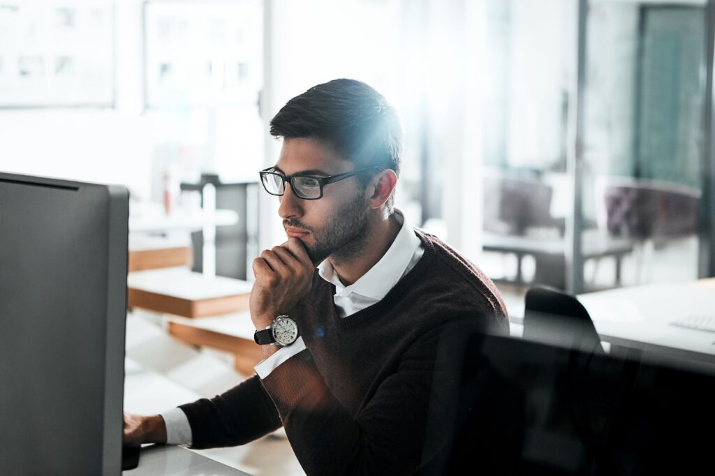 employee looking at firewall protection on computer
