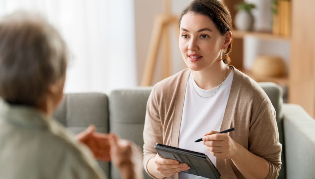 therapist talking to patient