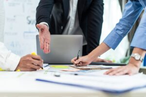business team collaborating over documents and planning strategies during a meeting