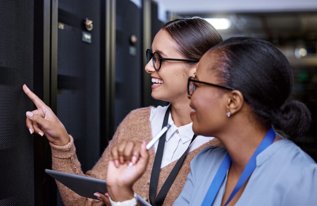 two woman looking at data backups