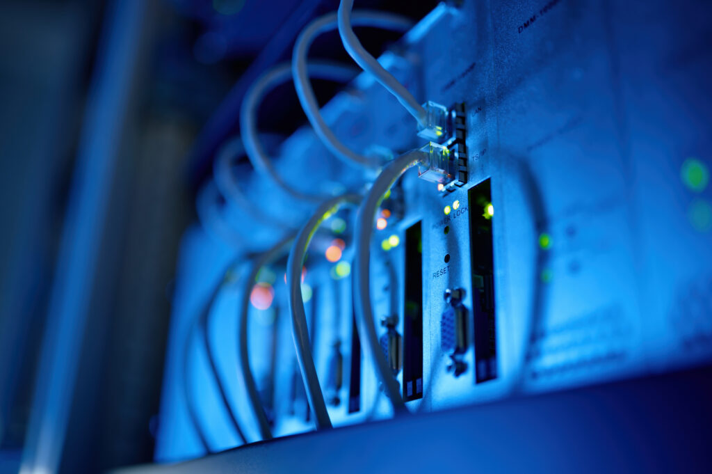 Closeup network server room with fiber optic hub
